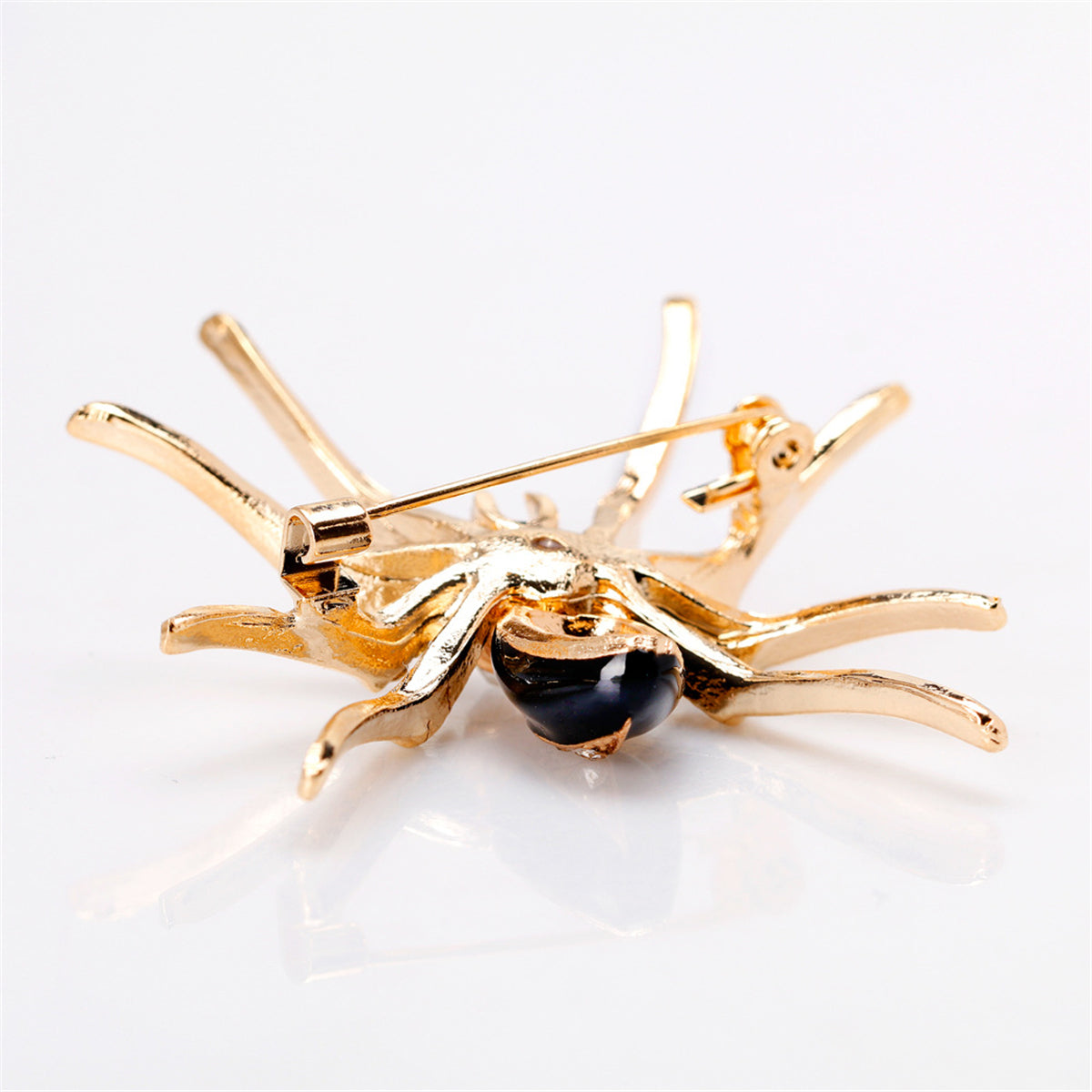 Cubic Zirconia and Black Enamel 18K Gold-Plated Spider Brooch, gold brooch pin, vintage-inspired design, detail close-up