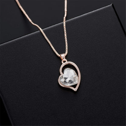 Crystal and 18K Rose Gold-Plated Heart Pendant Necklace and Earrings, rose gold drop earrings for women, detail close-up