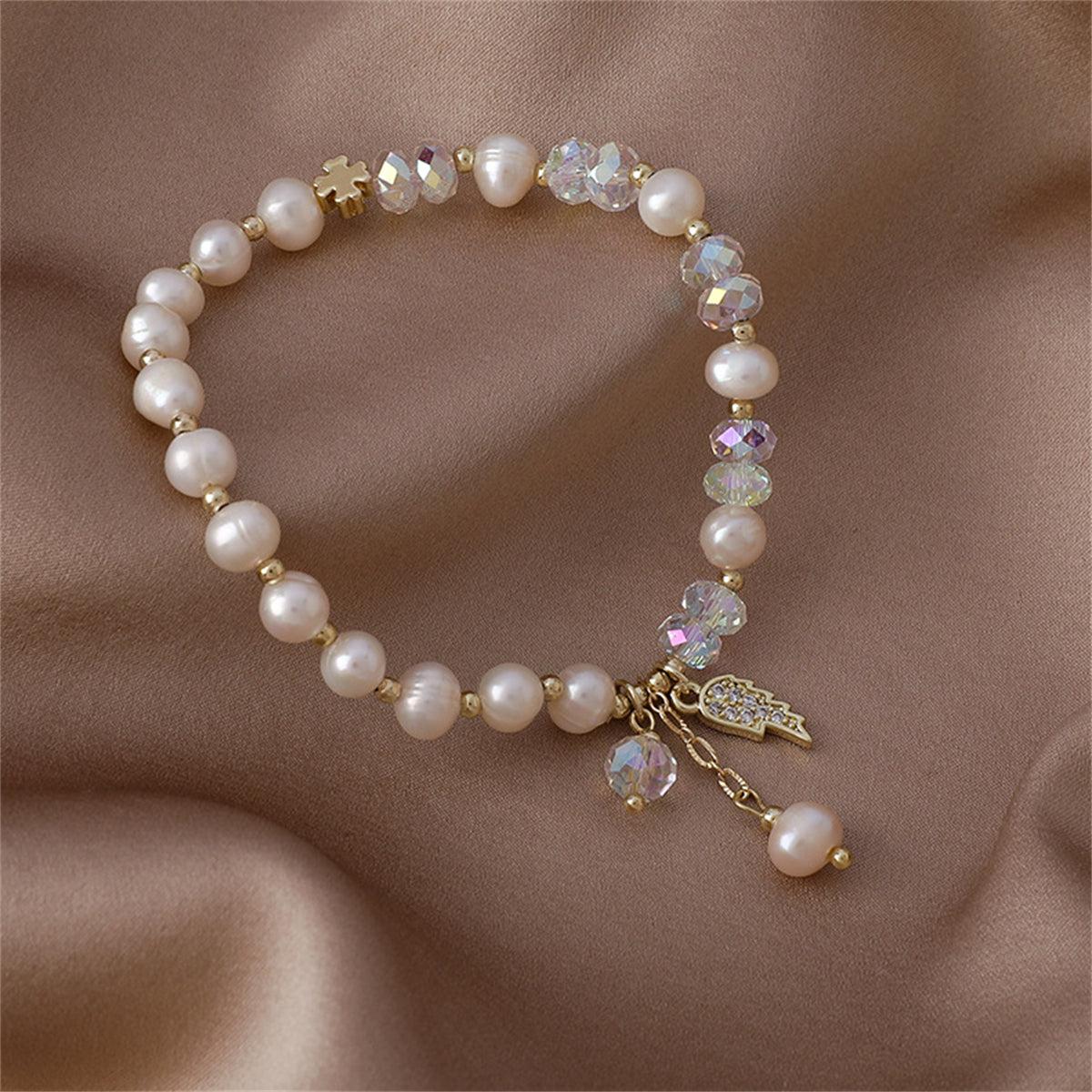 Pearl and Cubic Zirconia 18K Gold-Plated Wing Charm Stretch Bracelet, gold bracelet for women, detail close-up