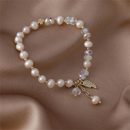 Pearl and Cubic Zirconia 18K Gold-Plated Wing Charm Stretch Bracelet, gold bracelet for women, detail close-up