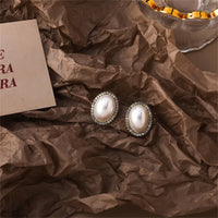 Cubic Zirconia & Pearl Oval Halo Stud Earrings