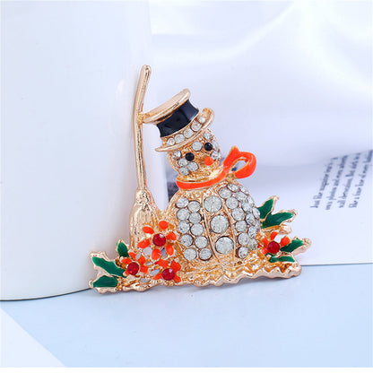 Orange Enamel and Cubic Zirconia Broom Snowman Brooch, brooch pin, vintage-inspired design, detail close-up