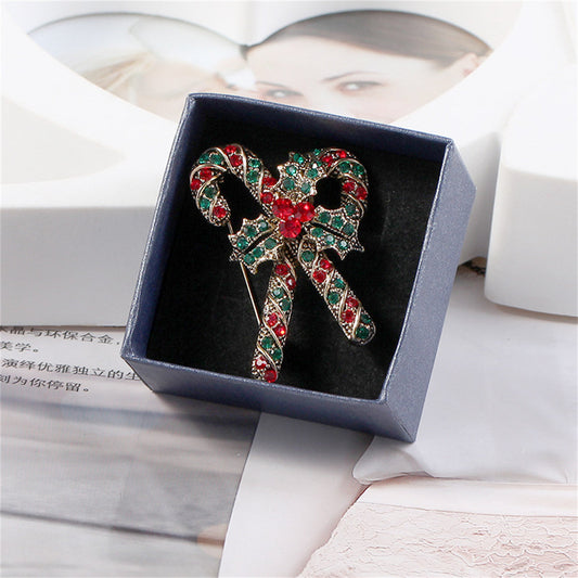 Red Cubic Zirconia and Silver-Plated Christmas Crutch Brooch, silver brooch pin, botanical inspired, front view