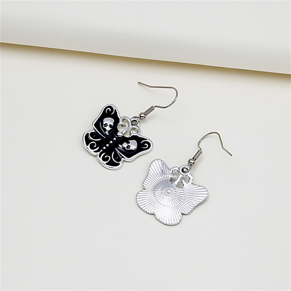 Black and Silver-Plated Skull Butterfly Drop Earrings, silver drop earrings for women, everyday style, detail close-up