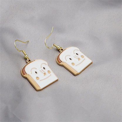 White Enamel and 18K Gold-Plated Toast Drop Earrings, gold drop earrings for women, vintage-inspired design, lifestyle look