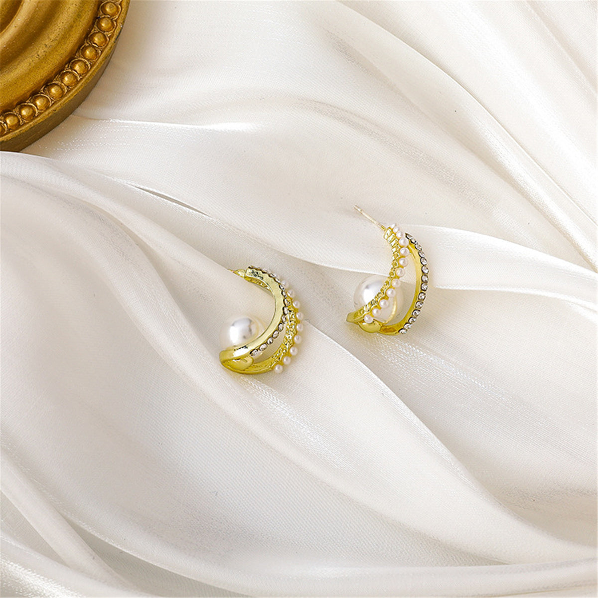 Pearl and Cubic Zirconia Curve Huggie Earrings, huggie earrings, botanical inspired, front view
