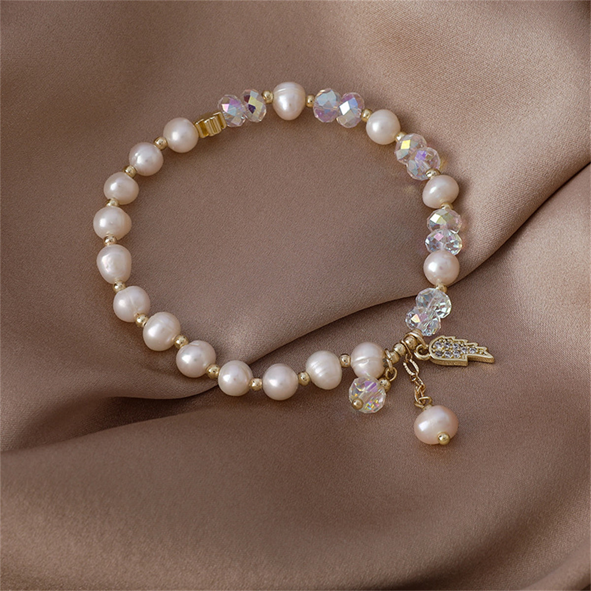Pearl and Cubic Zirconia 18K Gold-Plated Wing Charm Stretch Bracelet, gold bracelet for women, everyday style, lifestyle look
