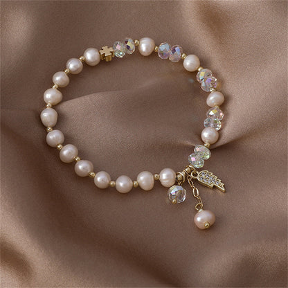 Pearl and Cubic Zirconia 18K Gold-Plated Wing Charm Stretch Bracelet, gold bracelet for women, everyday style, styled look