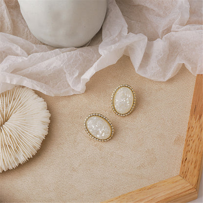 White Resin and 18K Gold-Plated Oval Stud Earrings, gold stud earrings for women, dainty minimalist design, front view