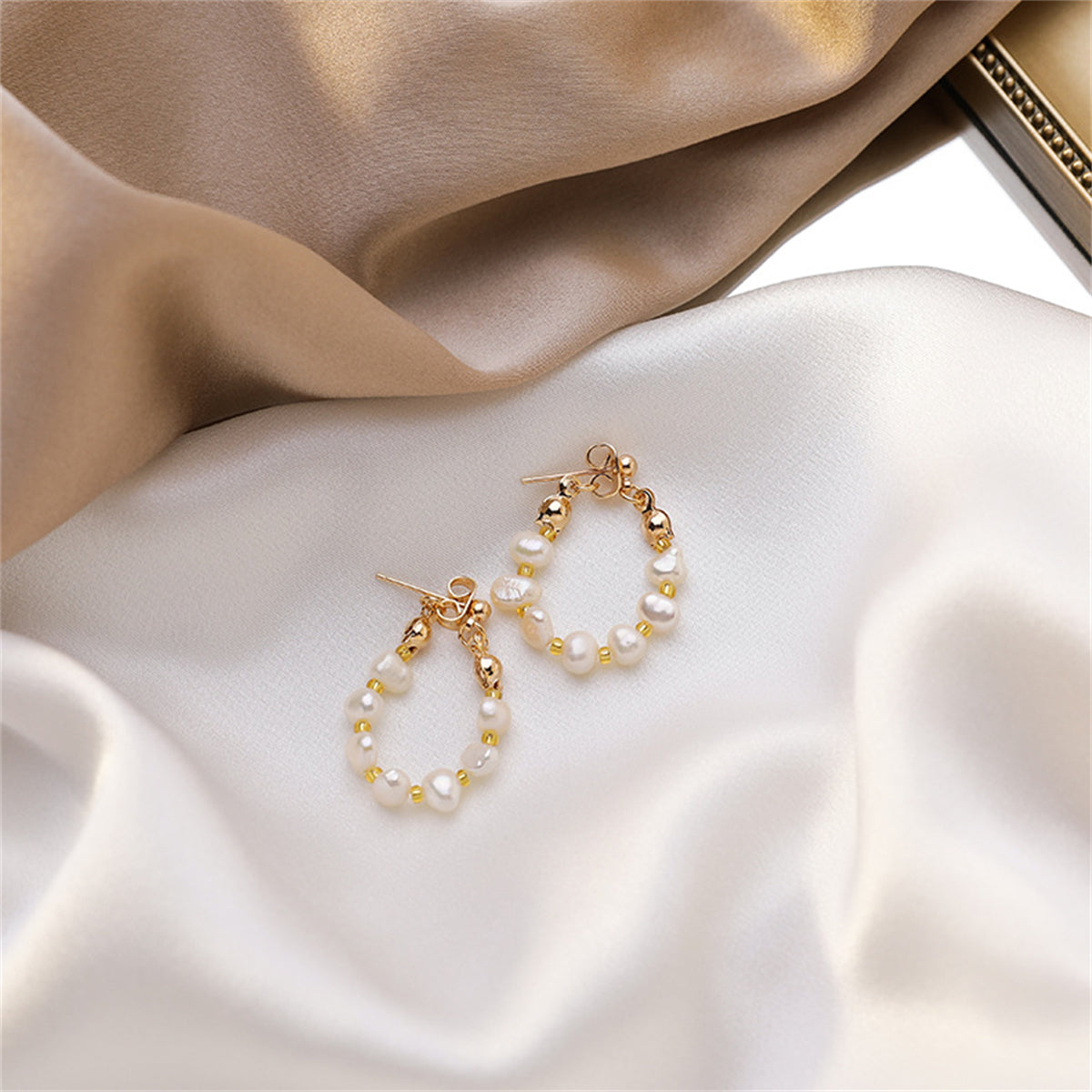 Pearl and 18K Gold-Plated Teardrop Ear Jackets, gold drop earrings for women, dainty minimalist design, detail close-up