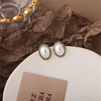 Cubic Zirconia & Pearl Oval Halo Stud Earrings