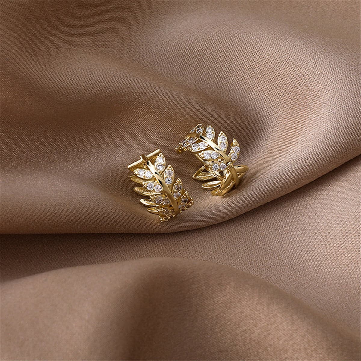 Cubic Zirconia and 18K Gold-Plated Leaf Huggie Earrings, gold huggie earrings, botanical inspired, detail close-up