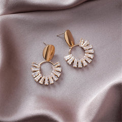 Dazzling 18K gold-plated earrings with a crystal circle drop design, combining luxurious gold and white for a stunning look.