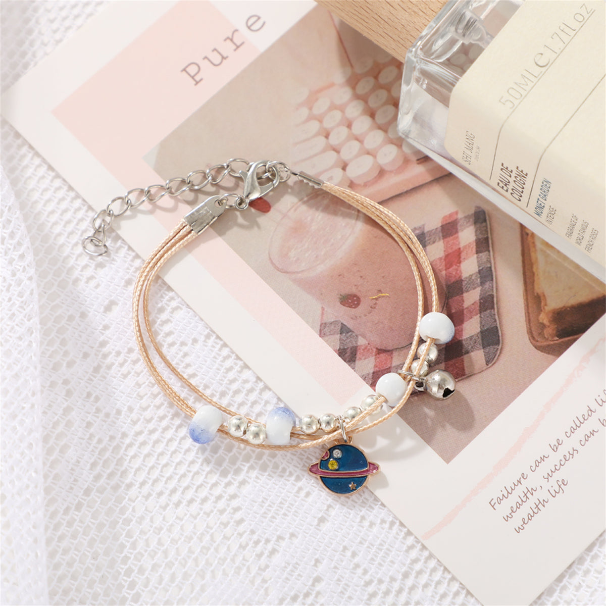 Cubic Zirconia and Blue Enamel Two-Tone Planet Layered Charm Bracelet, bracelet for women, everyday style, detail close-up