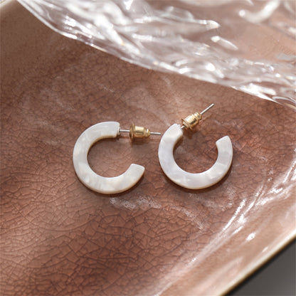 White Acrylic and 18K Gold-Plated Huggie Earrings, gold huggie earrings, dainty minimalist design, front view