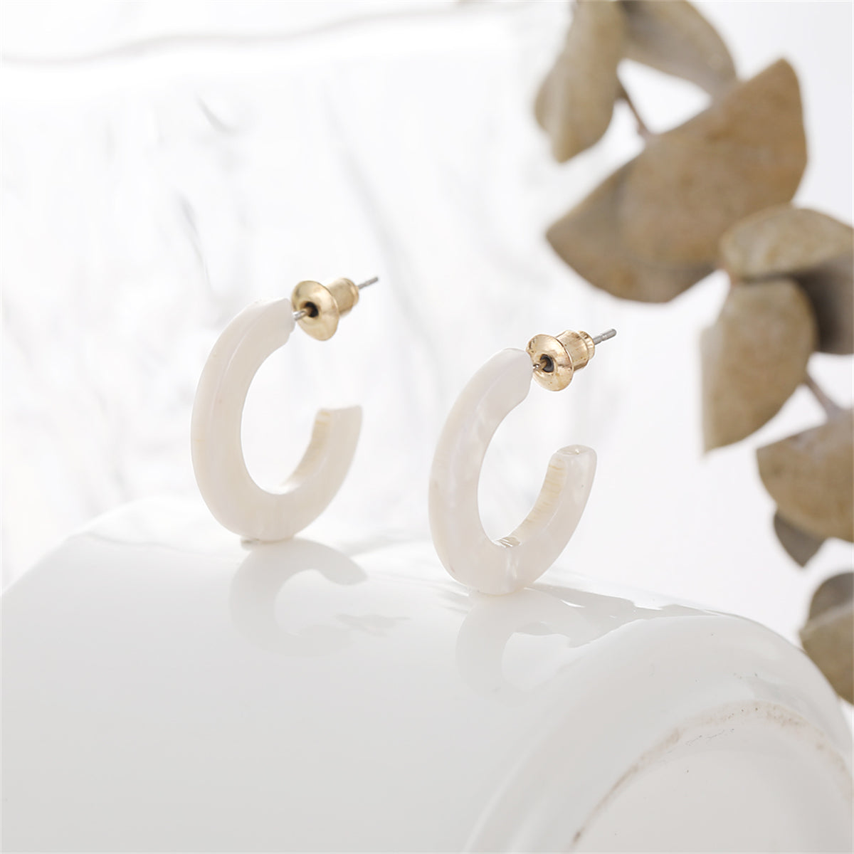 White Acrylic and 18K Gold-Plated Huggie Earrings, gold huggie earrings, dainty minimalist design, side view