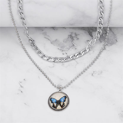 Blue Resin and Silver-Plated Butterfly Round Layered Pendant Necklace, jewelry gift sets for women, detail close-up