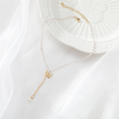 Pearl and 18K Gold-Plated Butterfly Drop Necklace, gold pendant necklace for women, botanical inspired, detail close-up