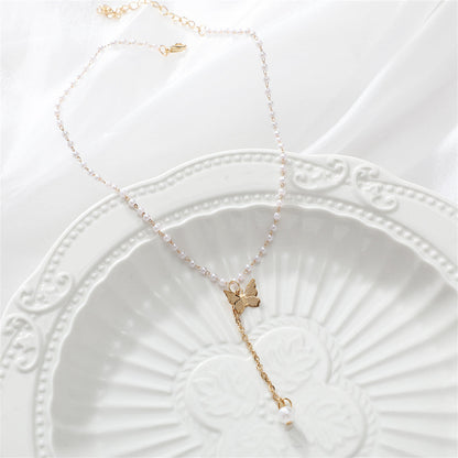 Pearl and 18K Gold-Plated Butterfly Drop Necklace, gold pendant necklace for women, botanical inspired, lifestyle look