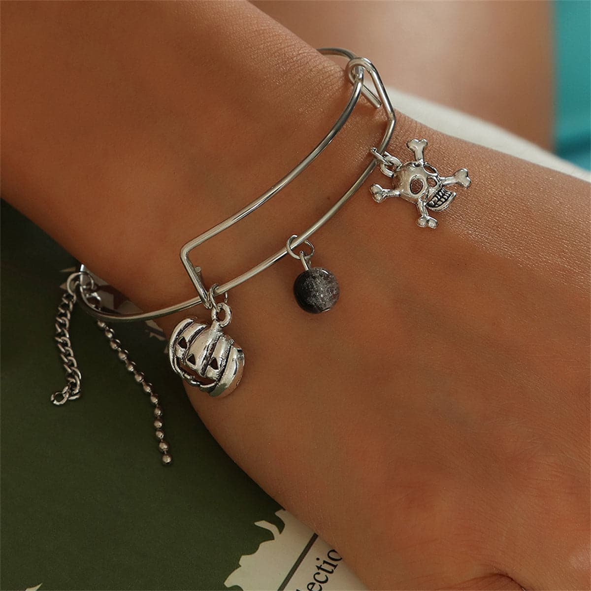 Black Glass and Silver-Plated Pumpkin Skull Charm Adjustable Bangle, silver bangle bracelet, elegant gift for her, front view