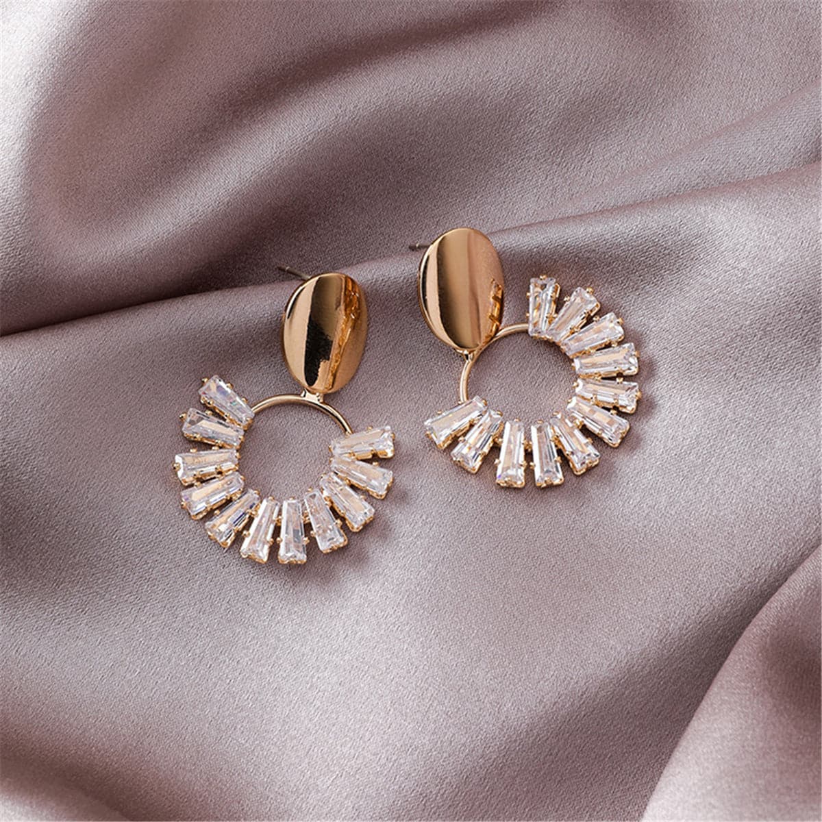 Chic 18K gold-plated circle drop earrings adorned with shimmering crystals, perfect for adding elegance to any outfit.