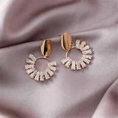 Chic 18K gold-plated circle drop earrings adorned with shimmering crystals, perfect for adding elegance to any outfit.