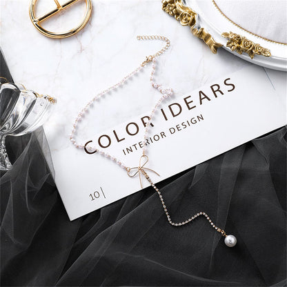Pearl and Cubic Zirconia Bow Lariat Necklace, pendant necklace for women, vintage-inspired design, lifestyle look