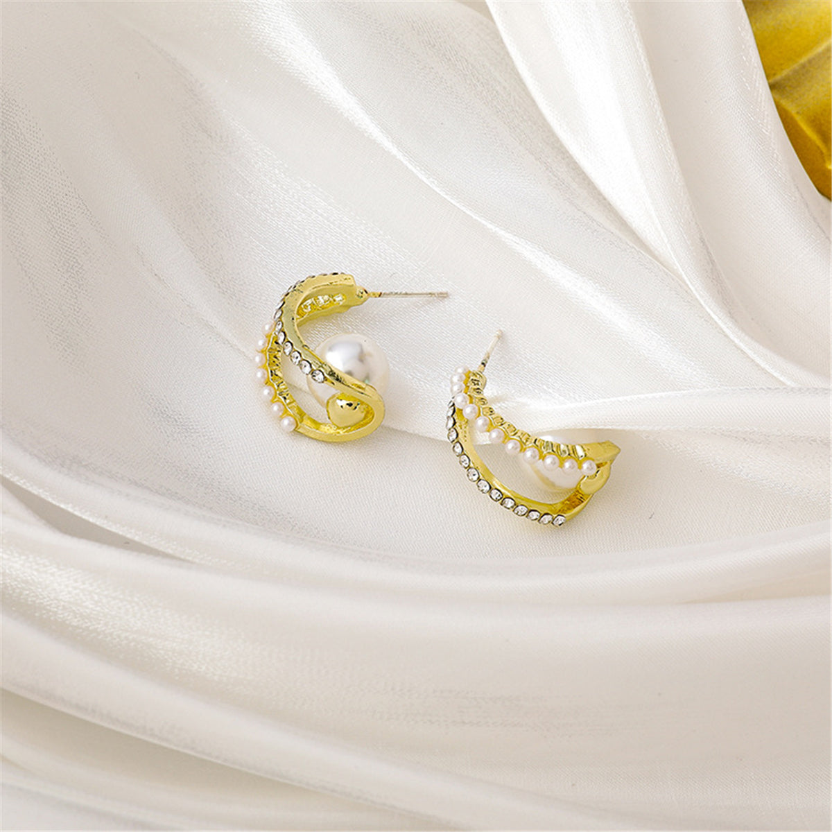 Pearl and Cubic Zirconia Curve Huggie Earrings, huggie earrings, botanical inspired, styled look