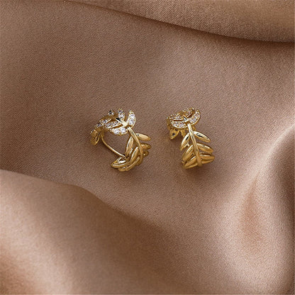 Cubic Zirconia and 18K Gold-Plated Leaf Huggie Earrings, gold huggie earrings, botanical inspired, lifestyle look