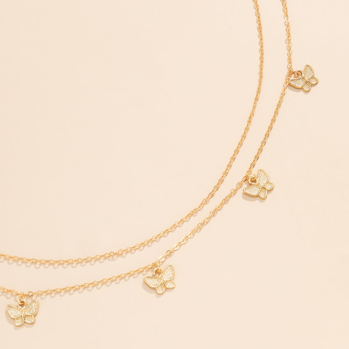 Chic 18K gold-plated butterfly waist chain set embellished with small charms, elevating your look with a touch of elegance.