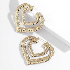 Unique heart hoop earrings made from bamboo, featuring a luxurious 18K gold plating for a fashionable touch.