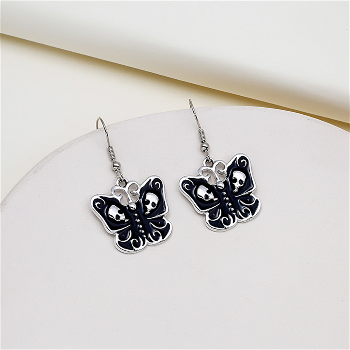 Black and Silver-Plated Skull Butterfly Drop Earrings, silver drop earrings for women, everyday style, front view