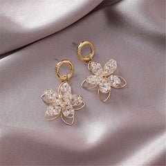 Elegant 18K gold-plated floral drop earrings adorned with sparkling crystals, perfect for any occasion.