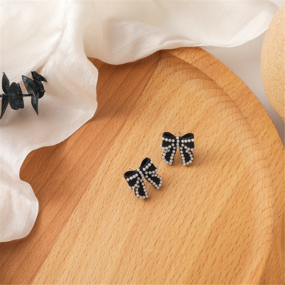 Pearl and Black Enamel Silver-Plated Bow Stud Earrings, silver stud earrings for women, botanical inspired, front view
