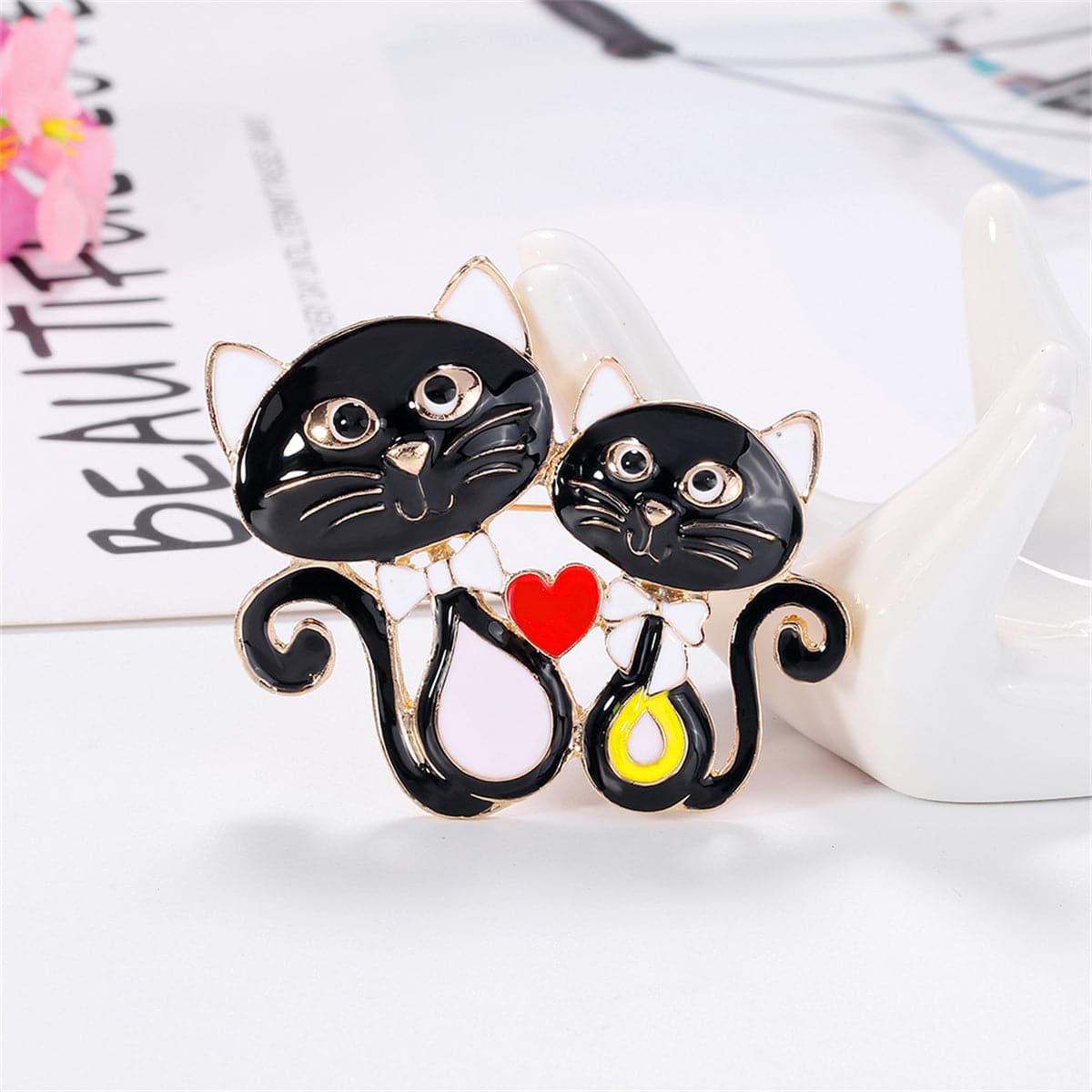 Black Enamel and 18K Gold-Plated Double-Cat Brooch, gold brooch pin, vintage-inspired design, front view