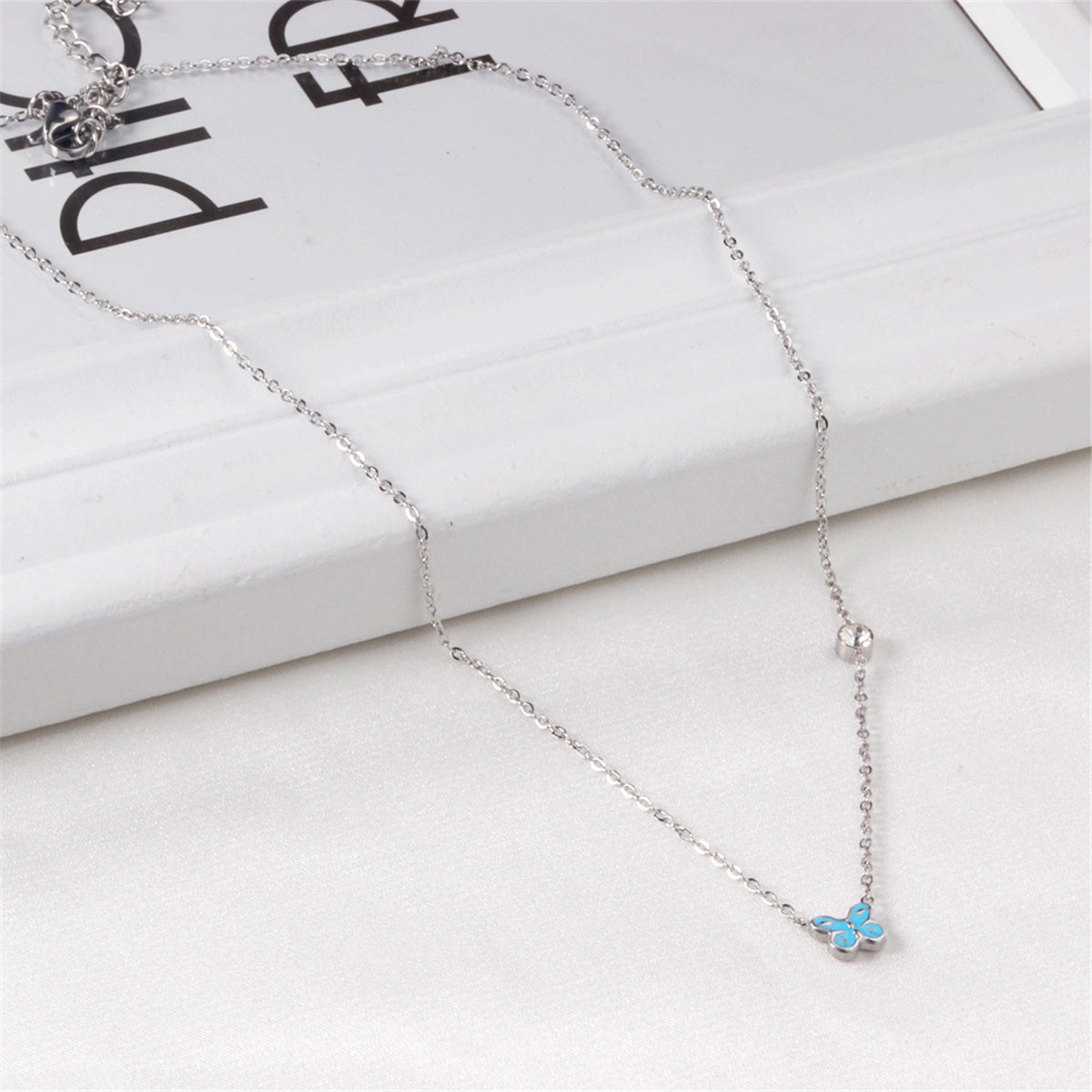 Lake Blue Enamel and Silver-Plated Cubic Zirconia-Accent Butterfly Pendant Necklace, silver pendant..., lifestyle look