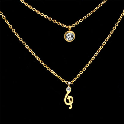 Cubic Zirconia and 18K Gold-Plated Clef Note Layered Pendant Necklace, gold pendant necklace for women, detail close-up