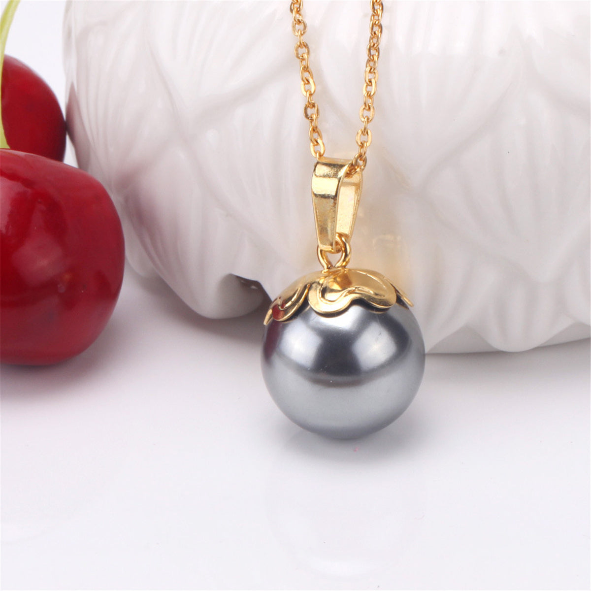 Black Pearl and 18K Gold-Plated Pendant Necklace and Stud Earrings, gold drop earrings for women, side view