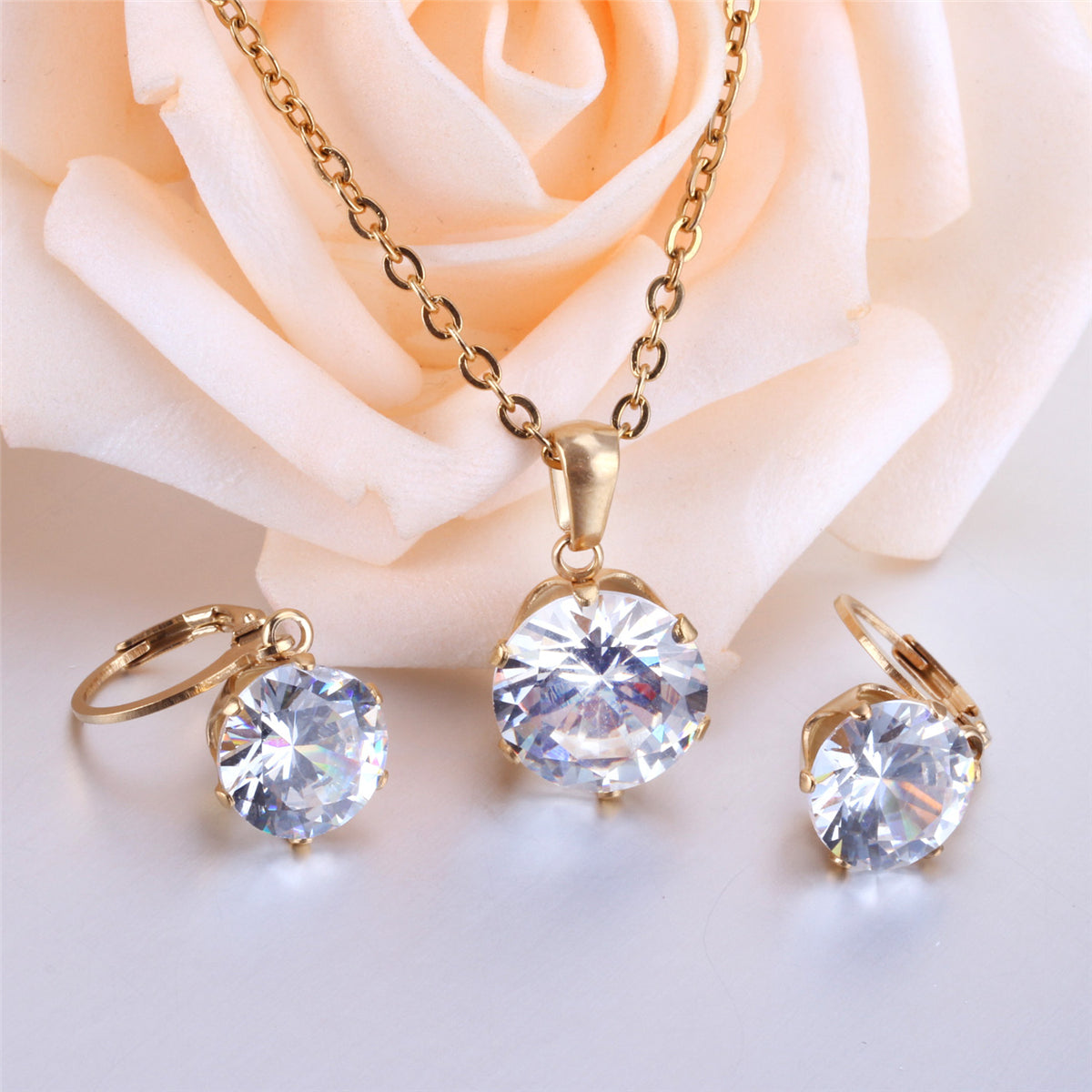 Cubic Zirconia and 18K Gold-Plated Drop Huggie Earrings and Pendant Necklace, gold huggie earrings, detail close-up