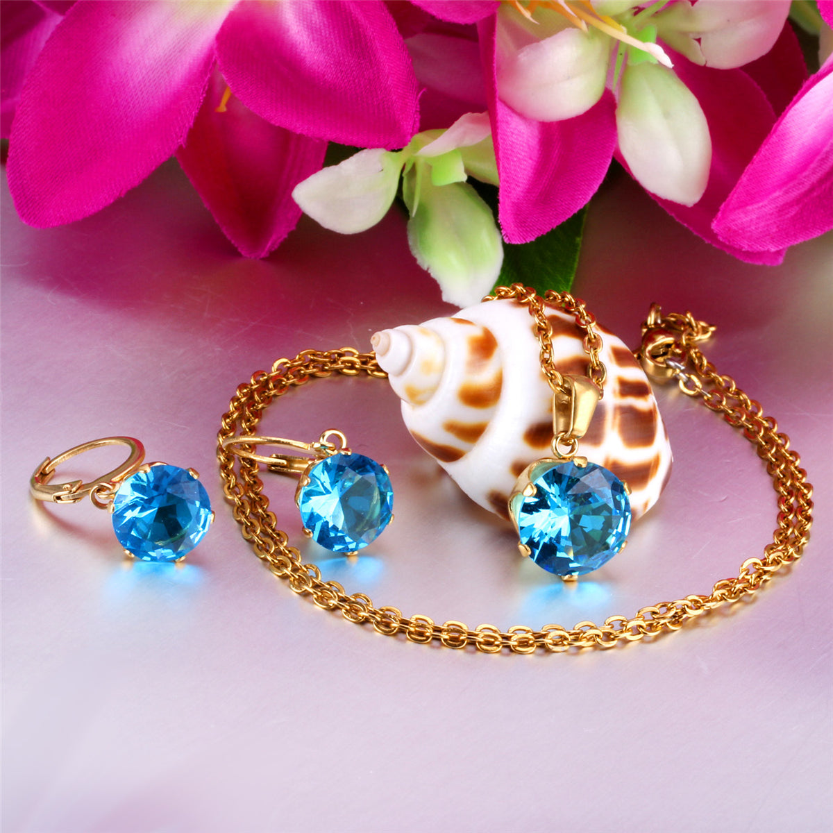 Light Blue Cubic Zirconia and 18K Gold-Plated Huggie Earrings and Pendant Necklace, gold huggie earrings, detail close-up