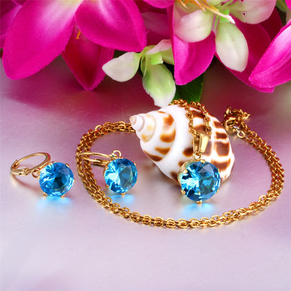 Light Blue Cubic Zirconia and 18K Gold-Plated Huggie Earrings and Pendant Necklace, gold huggie earrings, detail close-up