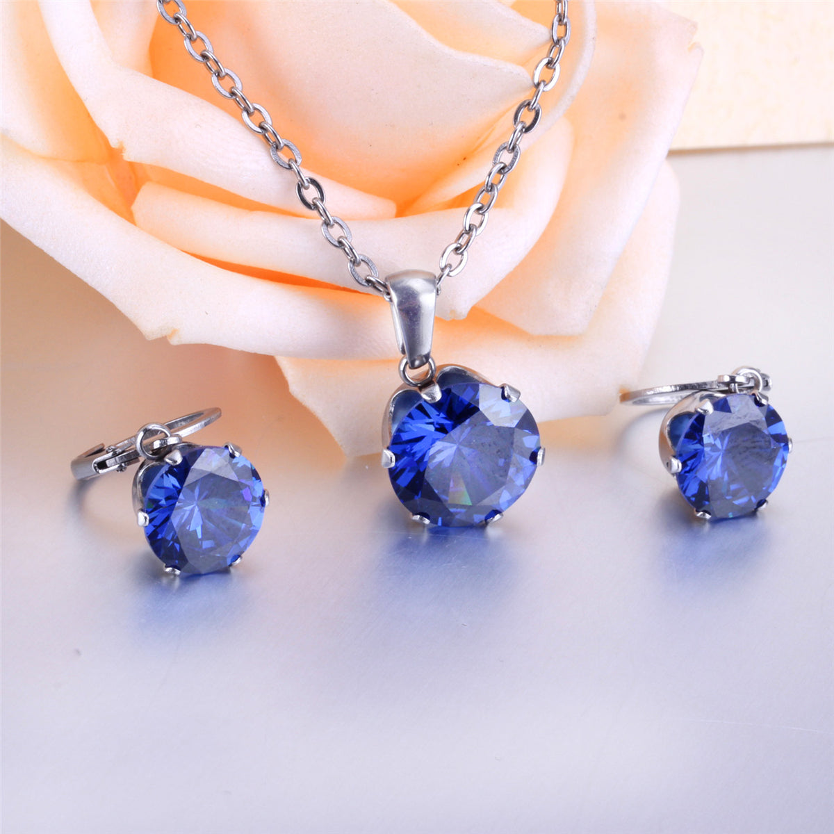 Blue Cubic Zirconia and Silver-Plated Huggie Earrings and Pendant Necklace, silver huggie earrings, detail close-up