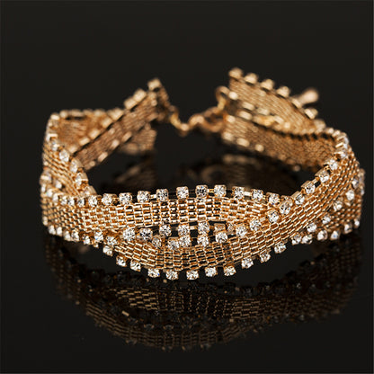 Cubic Zirconia and 18K Gold-Plated Crossing Weaving Bracelet, gold bracelet for women, dainty minimalist design, side view