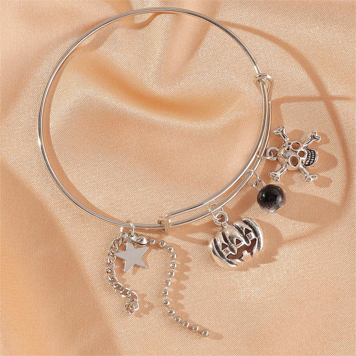Black Glass and Silver-Plated Pumpkin Skull Charm Adjustable Bangle, silver bangle bracelet, elegant gift for her, side view