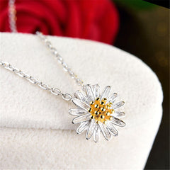 Beautiful white and yellow daisy pendant featuring a gold center, made from 18K gold-plated sterling silver for timeless elegance.