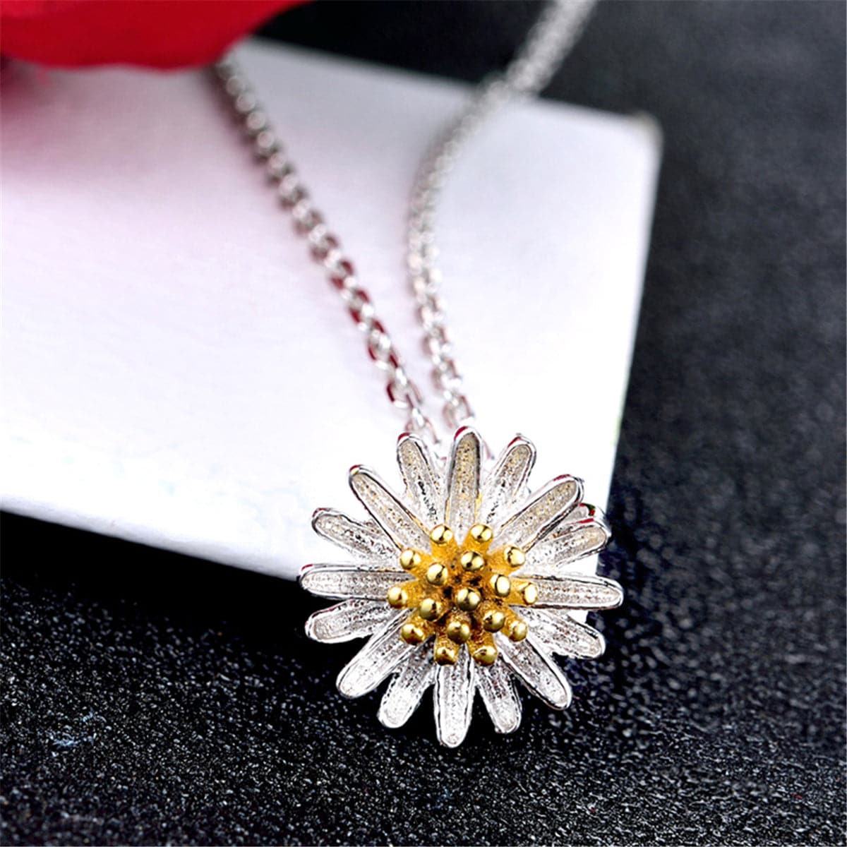 Delightful white and yellow daisy pendant with a gold center, crafted from 18K gold-plated sterling silver for a chic accessory.