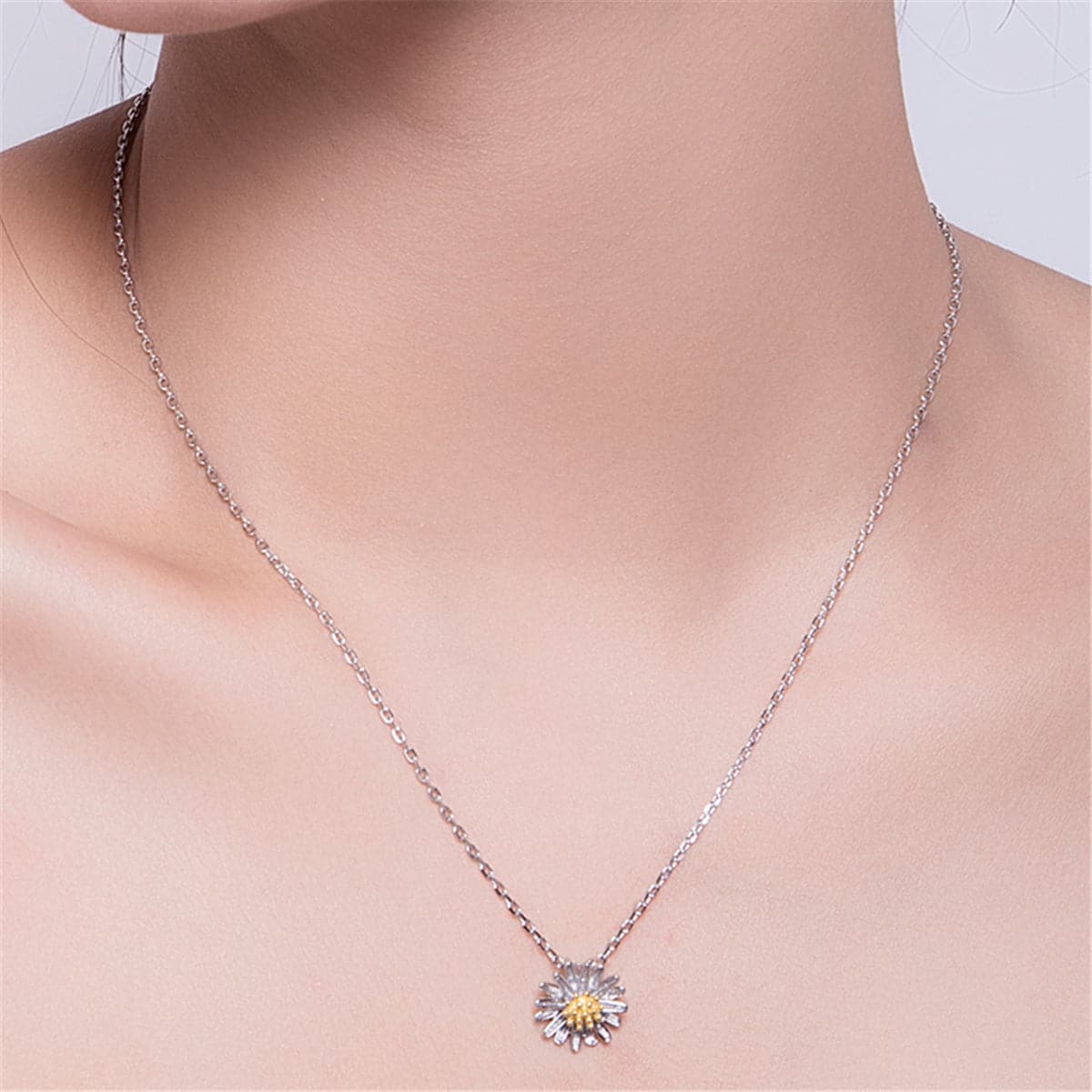 Elegant white and yellow daisy necklace with a gold center pendant, crafted in 18K gold-plated sterling silver for a stunning look.