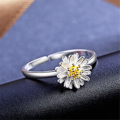 Beautiful flower ring showcasing a gold center, designed in 18K gold-plated sterling silver for a chic look.