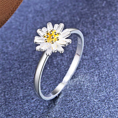 Eye-catching flower ring with a vibrant gold center, crafted from 18K gold-plated sterling silver for elegance.