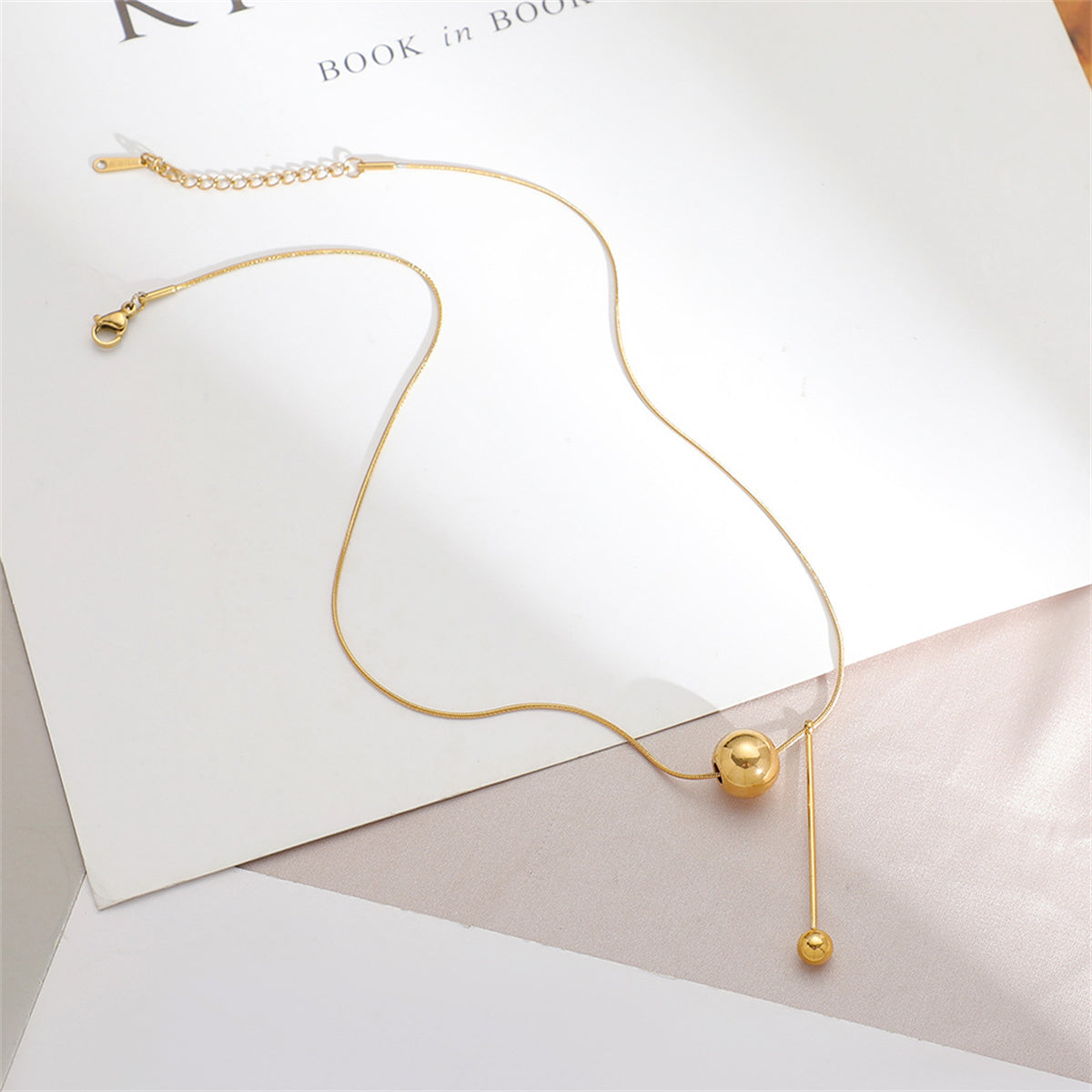 Stunning 18K gold-plated ball drop pendant necklace, a perfect blend of elegance and modern design for any outfit.